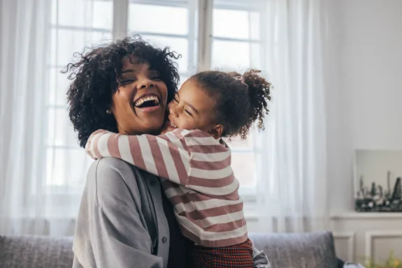 An adorable preschool child adores her mom